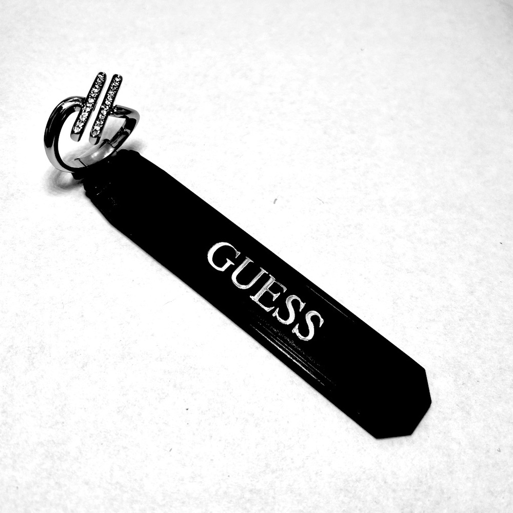 Guess brand Silver Ring size 9, has 24 crystals in offset double channel setting
